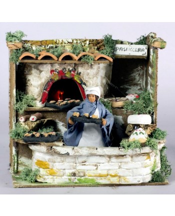 11334 Pasticciere a movimento e luce eff.fiamma cm. 20x14x18 - PERSONAGGIO PRESEPE NATALE
